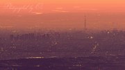富士山山頂から望む東京のビル群の夜明けと夜景の写真 「夜明けのTOKYO」